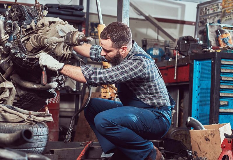 brutal-tattooed-mechanic-repairs-the-car-engine-in-small.jpg