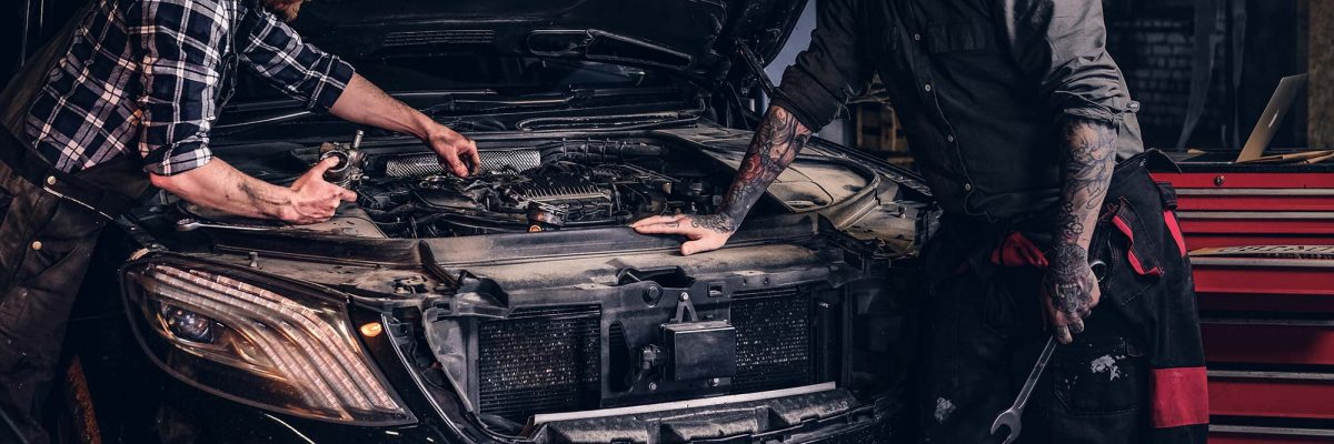 two-bearded-auto-mechanic-working-in-repair-garage-small.jpg